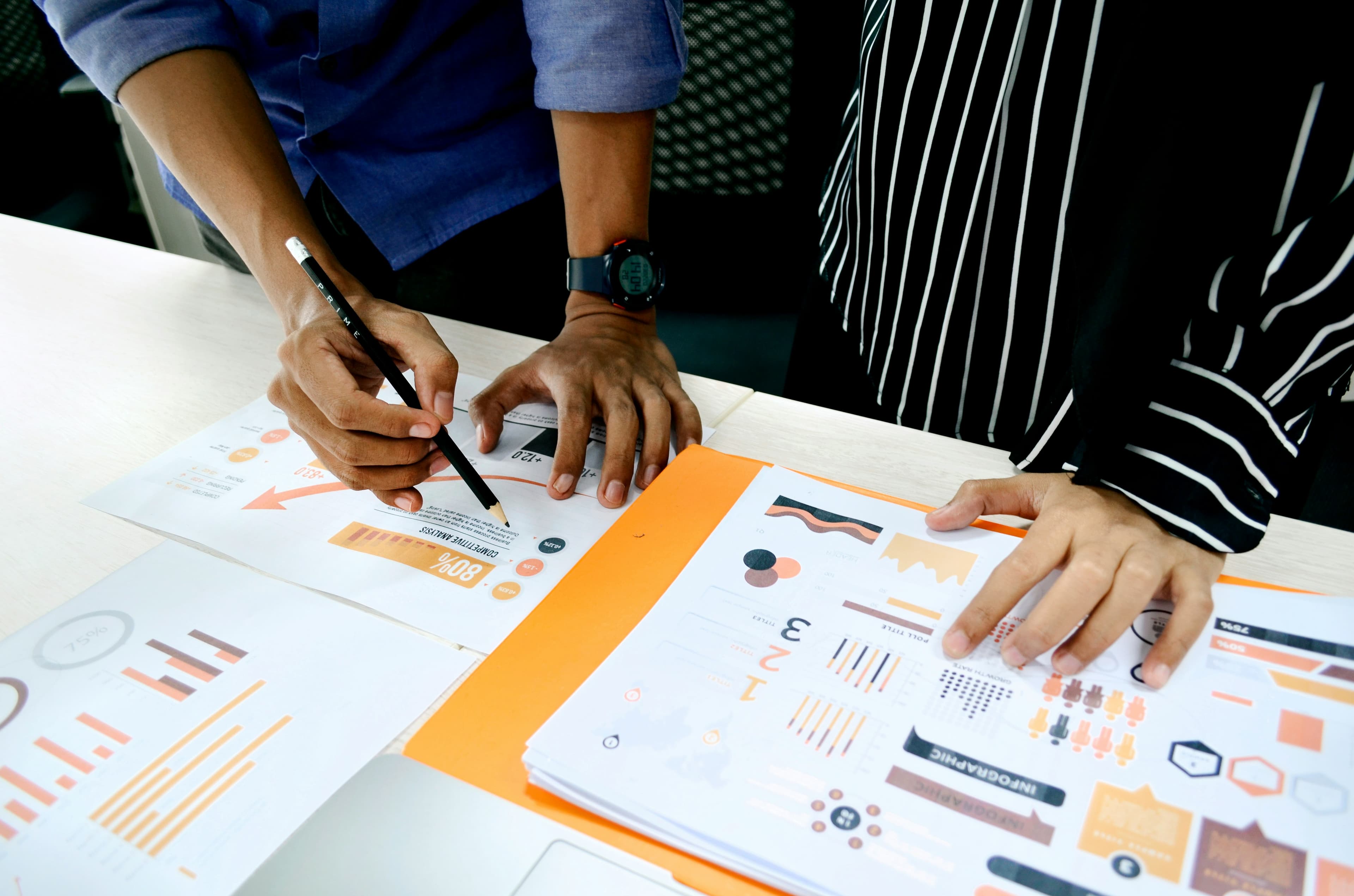 Academic staff reviewing postgraduate research progress